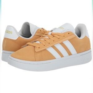 Women’s Adidas White and Orange Grand Court Alpha Sneakers.